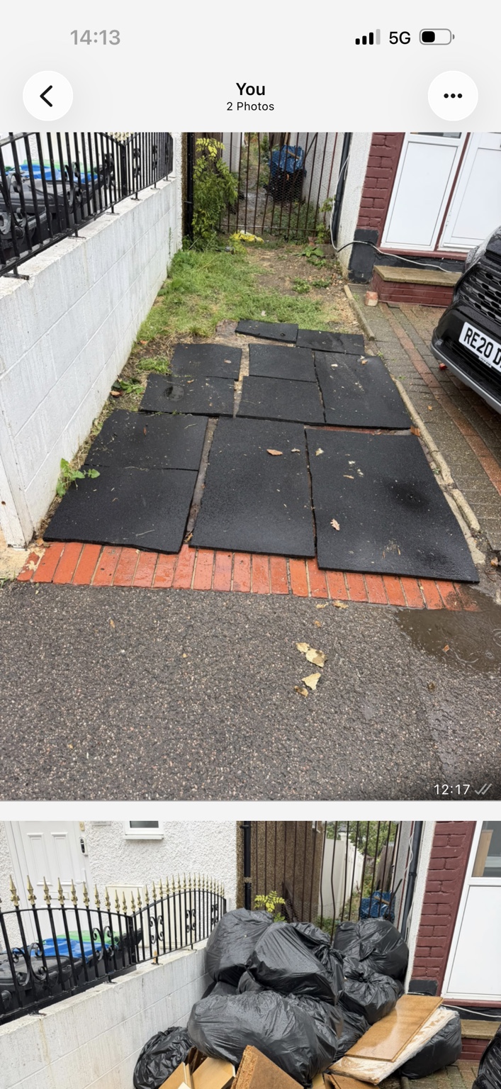 The same front garden after the bags and furniture boards were removed; the existing mats and garden remain.